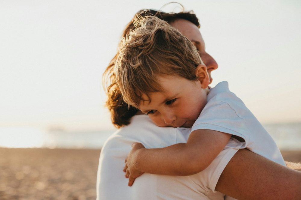 A Sunshine Coast parent holding their child